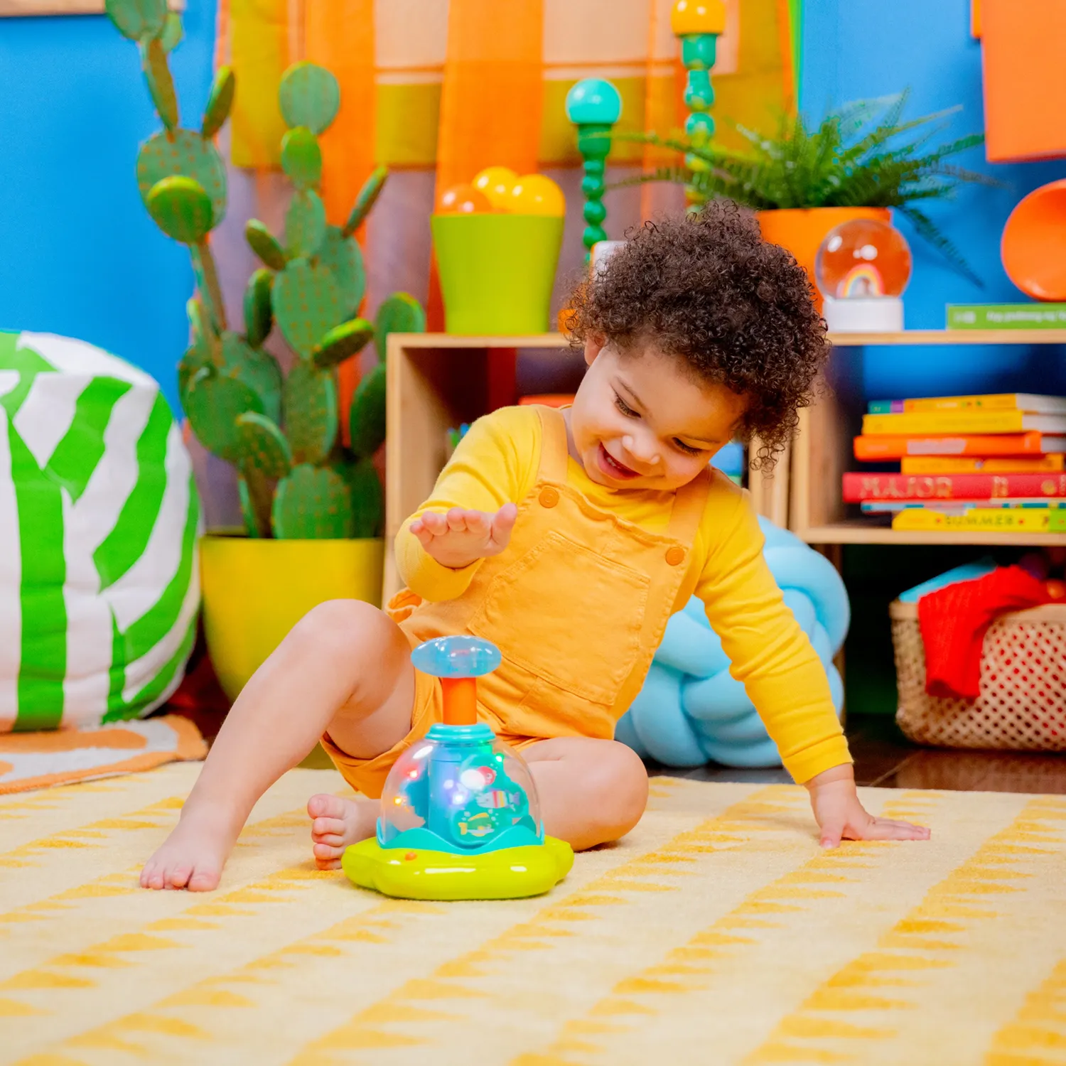Bright Starts Press & Glow Spinner Musikspielzeug mit Licht