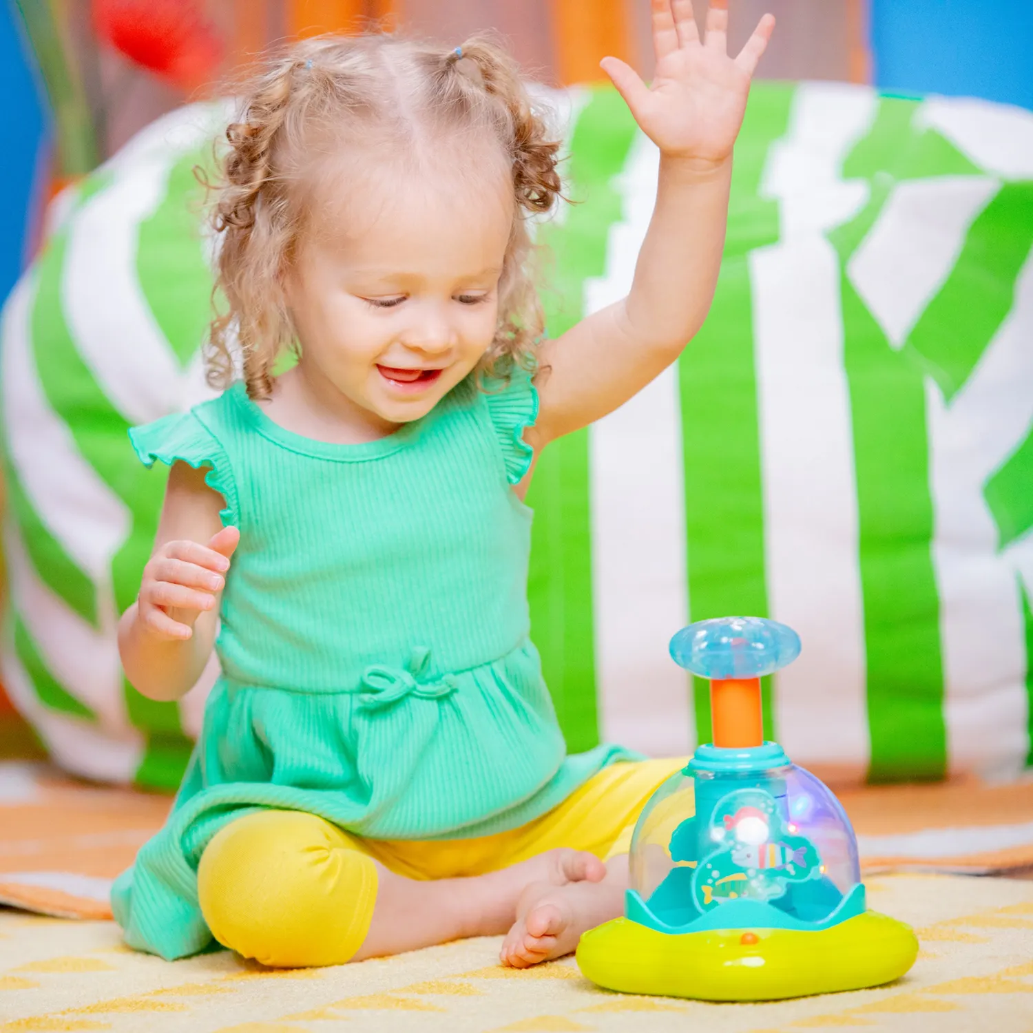 Bright Starts Press & Glow Spinner Musikspielzeug mit Licht