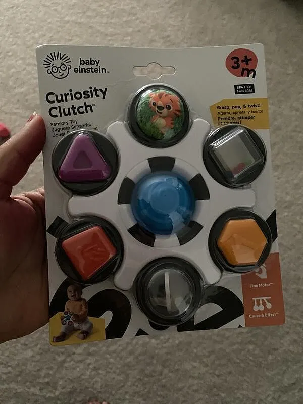 Baby Einstein Curiosity Clutch Twist Pop Rassel Greifspielzeug